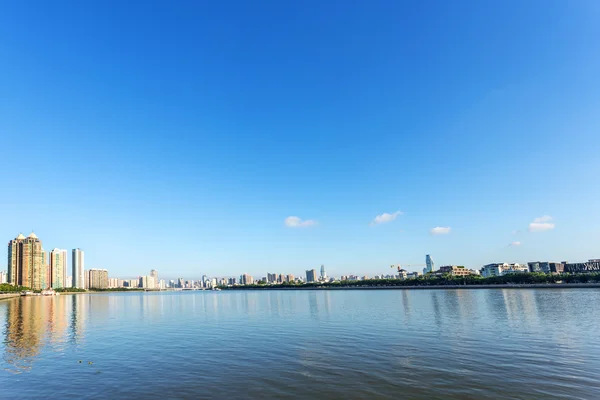 Skyscrapers by the river bank — Stock Photo, Image