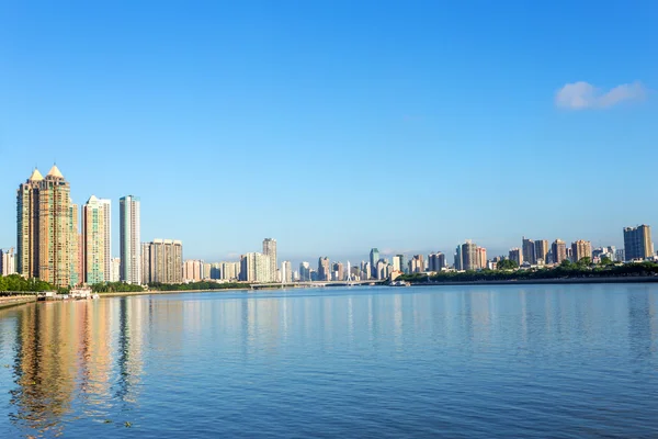 Skyscrapers by the river bank — Stock Photo, Image