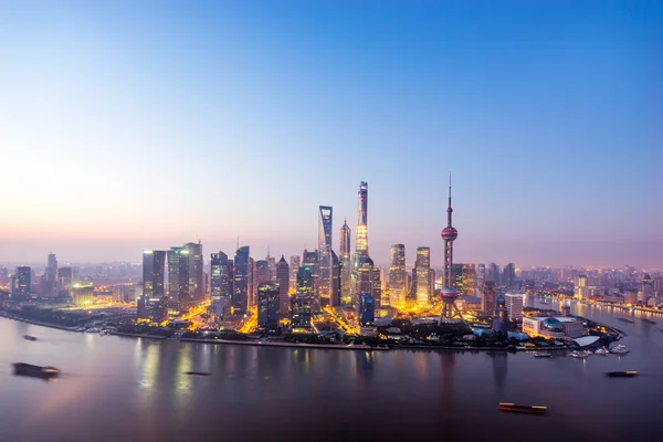 Skyscrapers of the city in China around a river at dusk — Stock Photo, Image