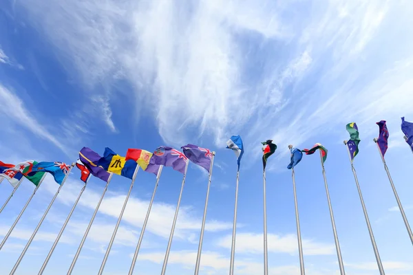 Flags in blue sky — Stock Photo, Image