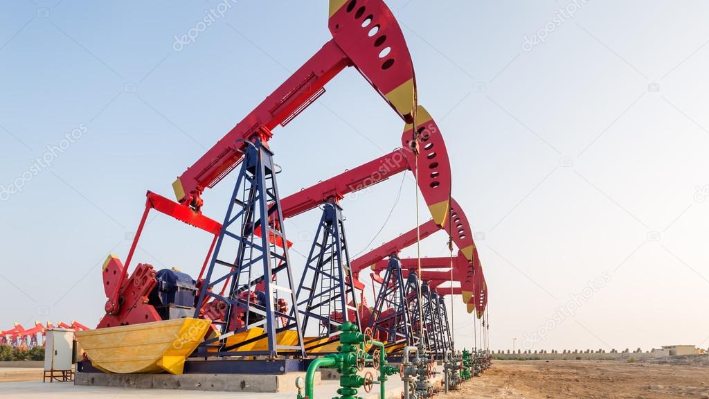 landscape of oilfield with pump units
