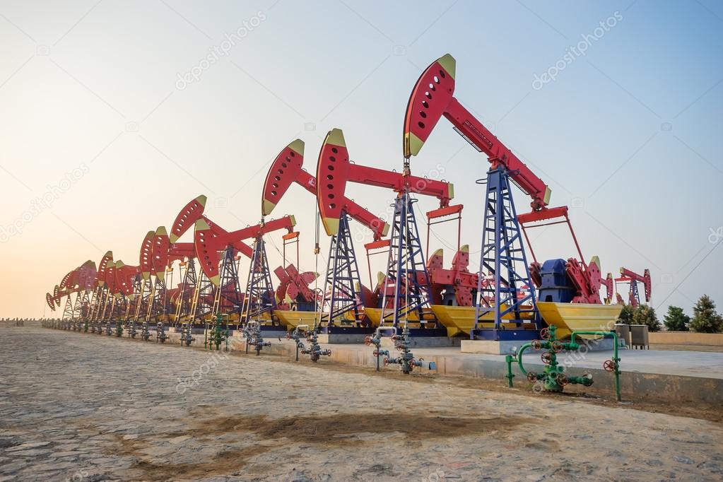 working oil-rig in oilfield in clear sky