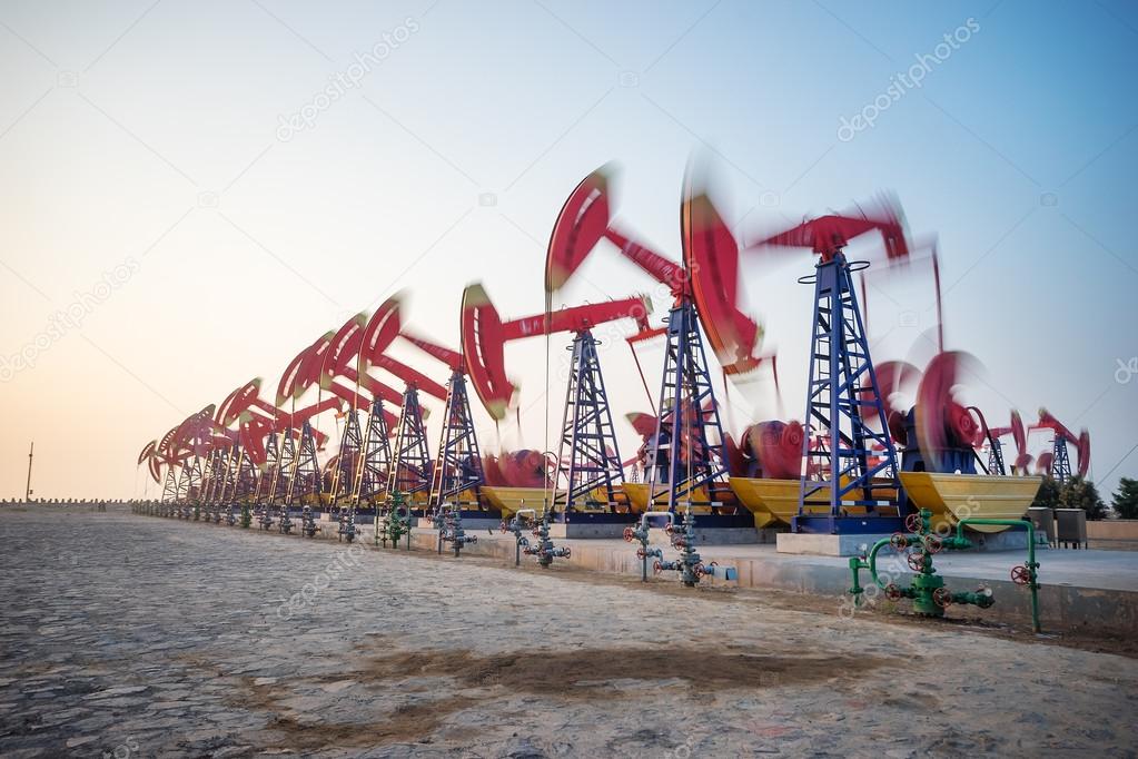 working oil-rig in oilfield in clear sky