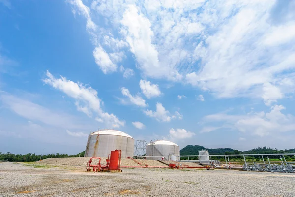 Oil tanks stand in empty ground — Stock Photo, Image