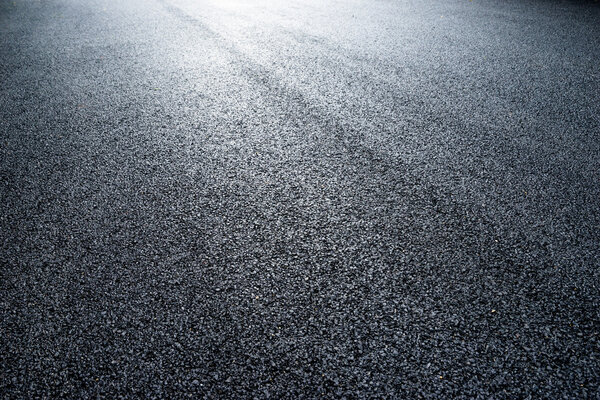 asphalt road under light 