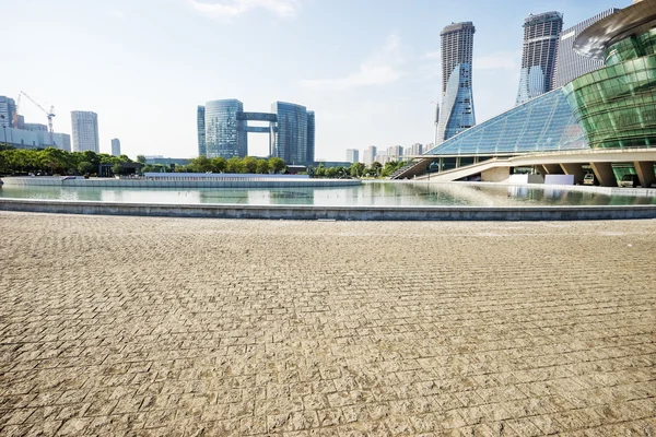 Skyline and empty ground front of modern buildings — Stock Photo, Image