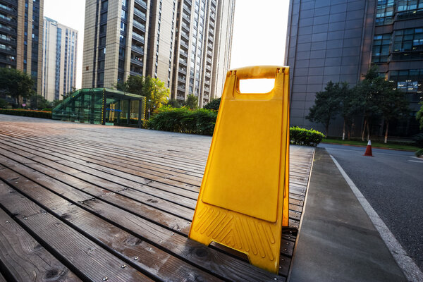 parking sign on ground front building