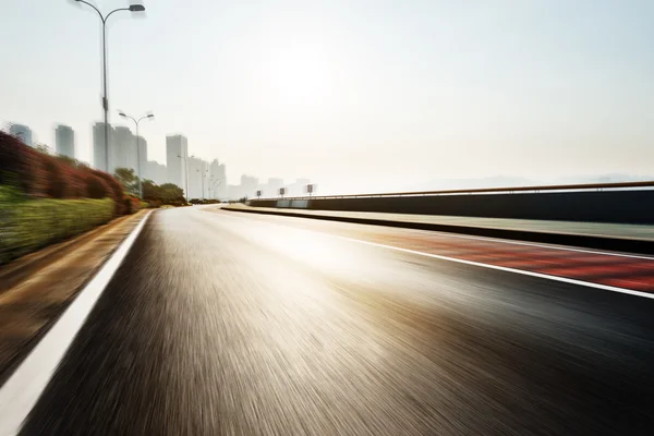 Asphalt road with traffic signs — Stock Photo, Image