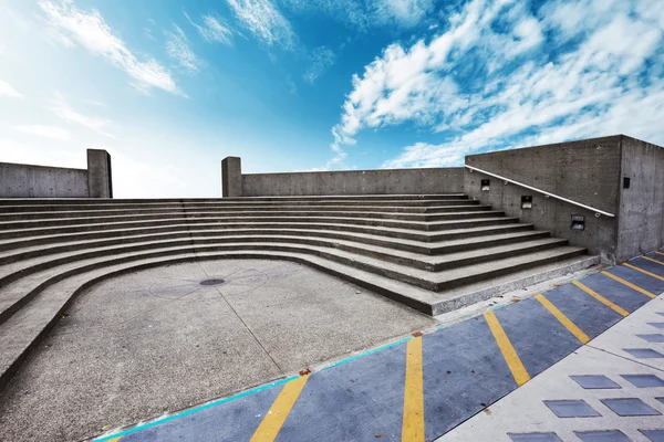 Skyscape on view of empty ground with steps — Stock Photo, Image