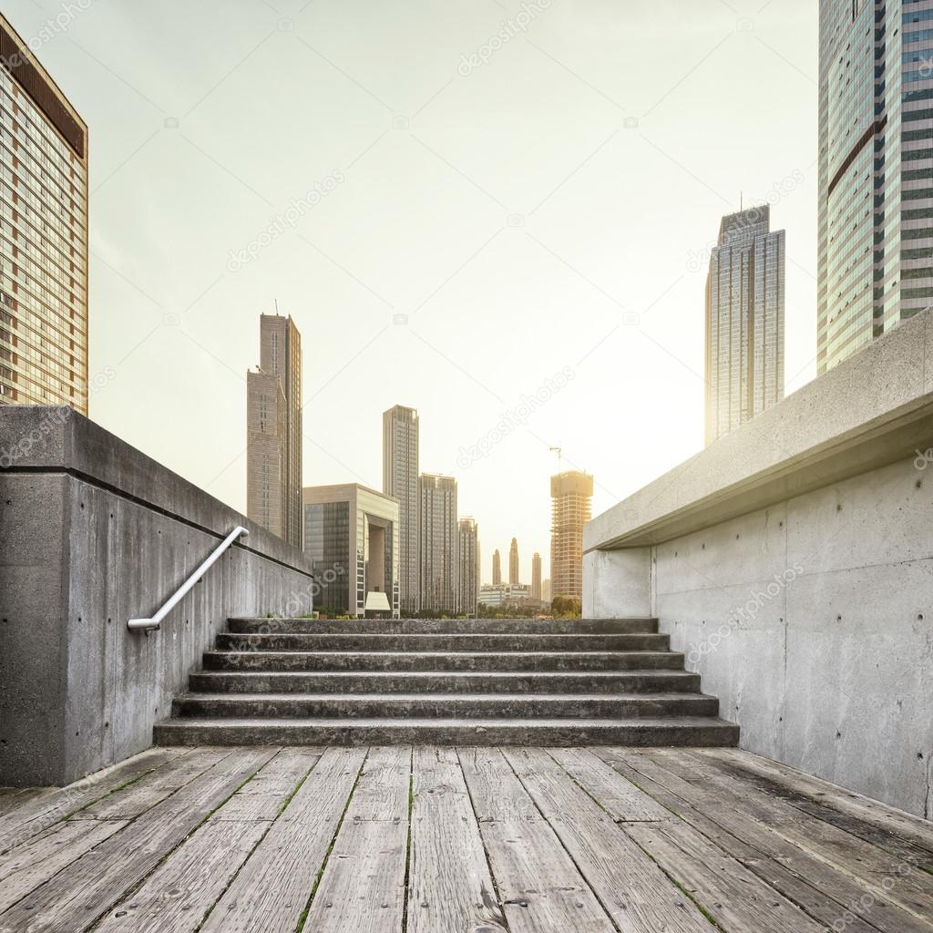 skyline and wooden floor in front of buildings