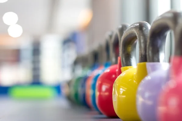 Colorful kettlebells in gym or sport club — Stock Photo, Image