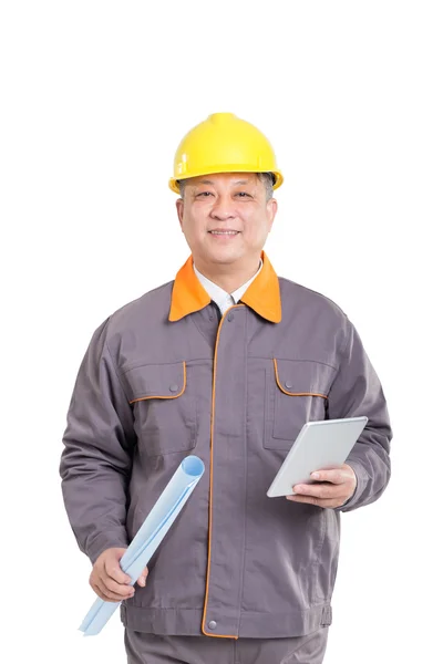 Engineer in hardhat with blueprint and tablet — Stock Photo, Image