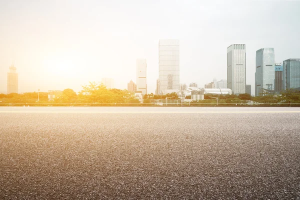 Floor with modern cityscape at sunrise time — Stock Photo, Image