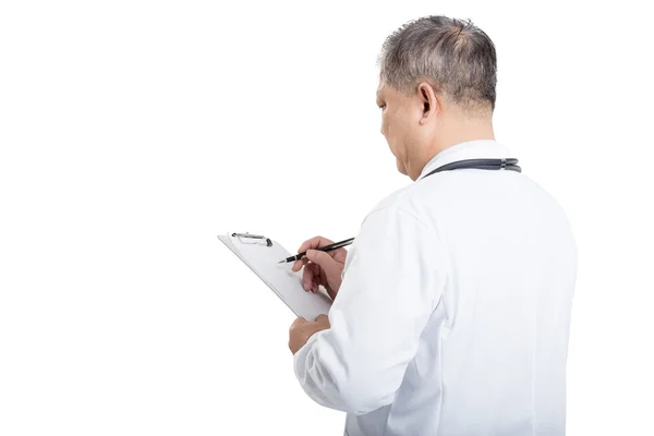 Man doctor with stethoscope writing on the board — Stock Photo, Image