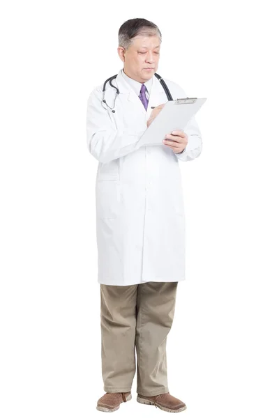 Man doctor with stethoscope writing on the clipboard — Stock Photo, Image