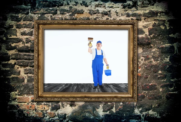House painter covers  inside of empty frame — Stock Photo, Image