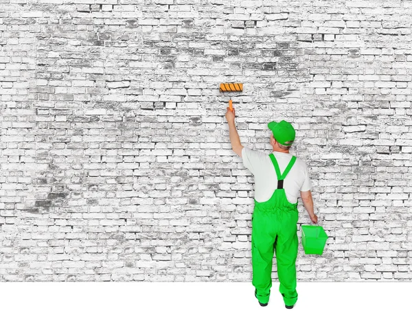 Painter covers white  brick wall — Stock Photo, Image