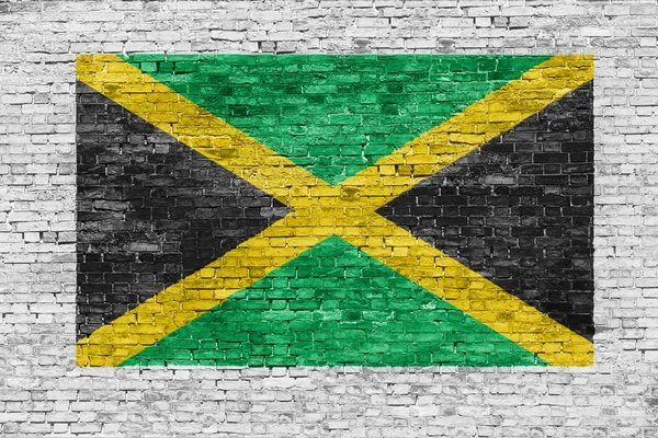 Bandera de Jamaica pintada sobre muro de ladrillo —  Fotos de Stock