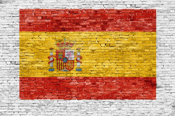 Bandeira espanhola pintada na parede de tijolo — Fotografia de Stock