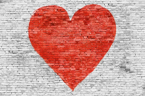 Symbol of love painted on brick wall — Stock Photo, Image