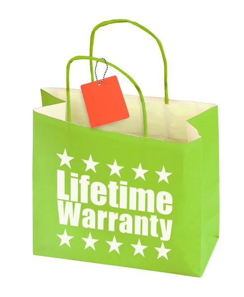 Paper bag with lifetime warranty inscription — Stock Photo, Image