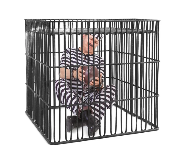 Prisoner struggling with ball and chain — Stock Photo, Image