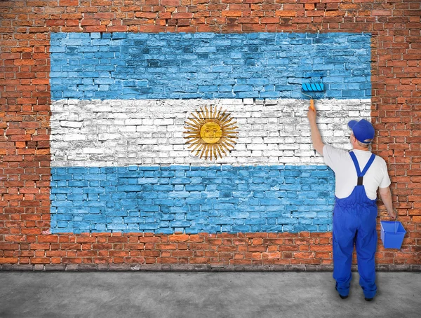 Malarz maluje flagę Argentyny — Zdjęcie stockowe