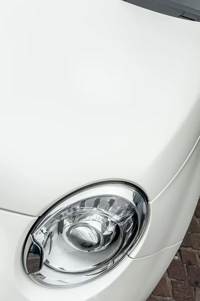 Headlights of a white car — Stock Photo, Image