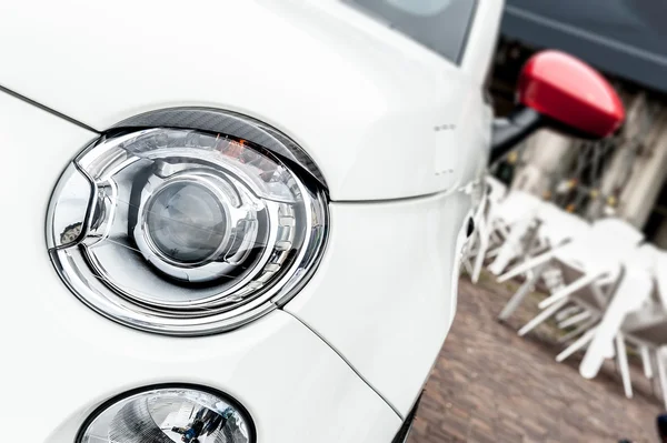 Headlights of a white car — Stock Photo, Image