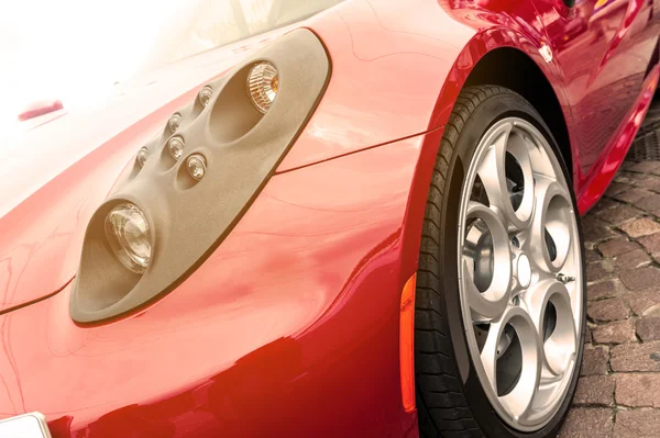 Red car in sunset — Stock Photo, Image