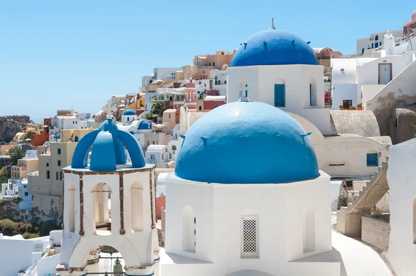 View of Oia in Santorini with a blue dome Stock Picture