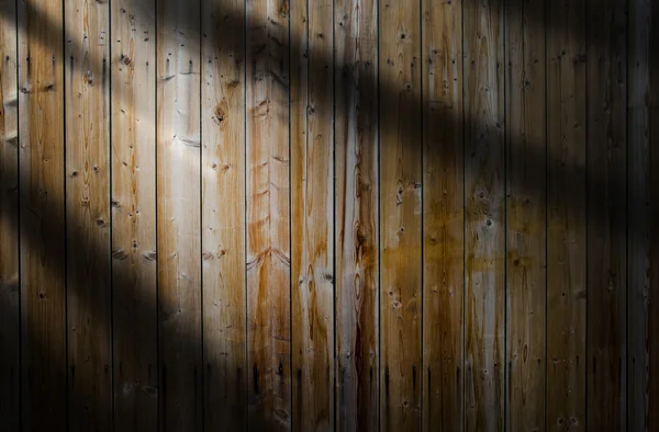 Haz de luz sobre fondo de madera —  Fotos de Stock