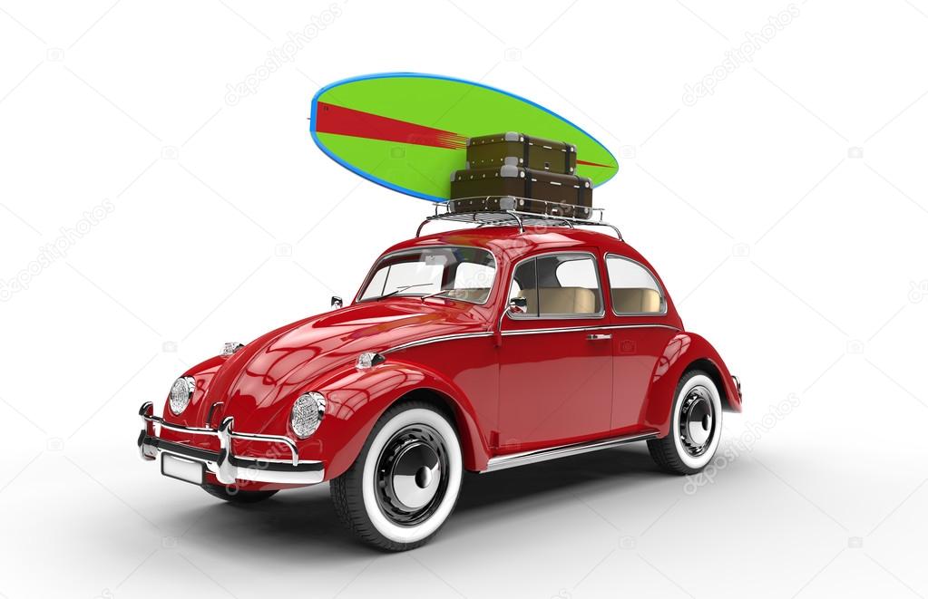 Old red car with surfboard and luggage