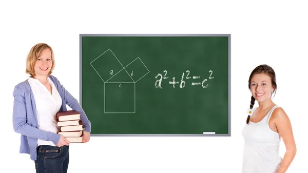 在黑板前的年轻教师和女学生 毕达哥拉斯定理被显示在黑板上 被白色背景隔离 — 图库照片