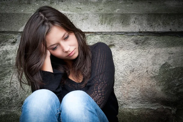 Teenage girl looking thoughtful about troubles — Stock Photo, Image