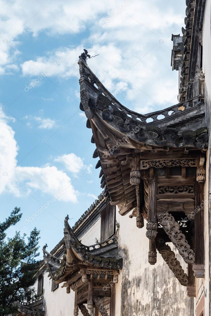 chinese traditional architecture closeup, carved wooden door head of Hui style old buildings