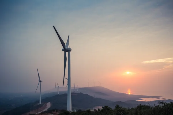 Wind farm by the lake in sunrise — Stock Photo, Image