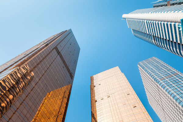 Modern buildings against a blue sky ,viewed from belo
