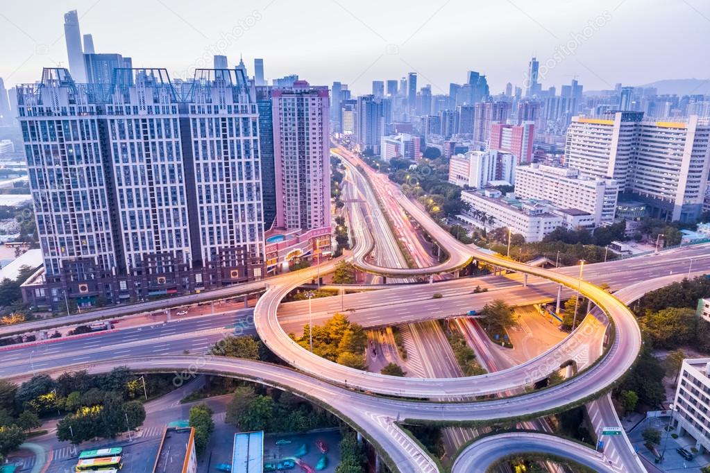 a highway interchange in guangzhou at dusk