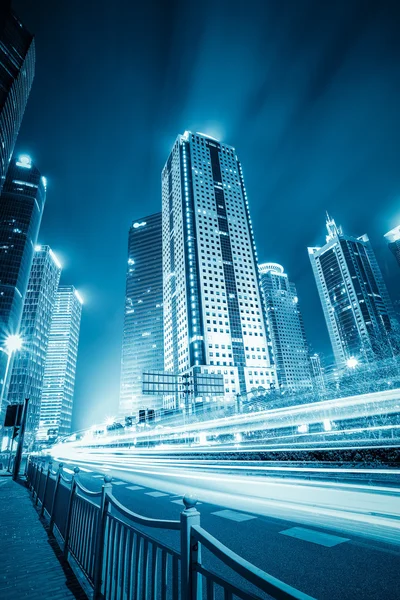 Futuristic city with light trails — Stock Photo, Image