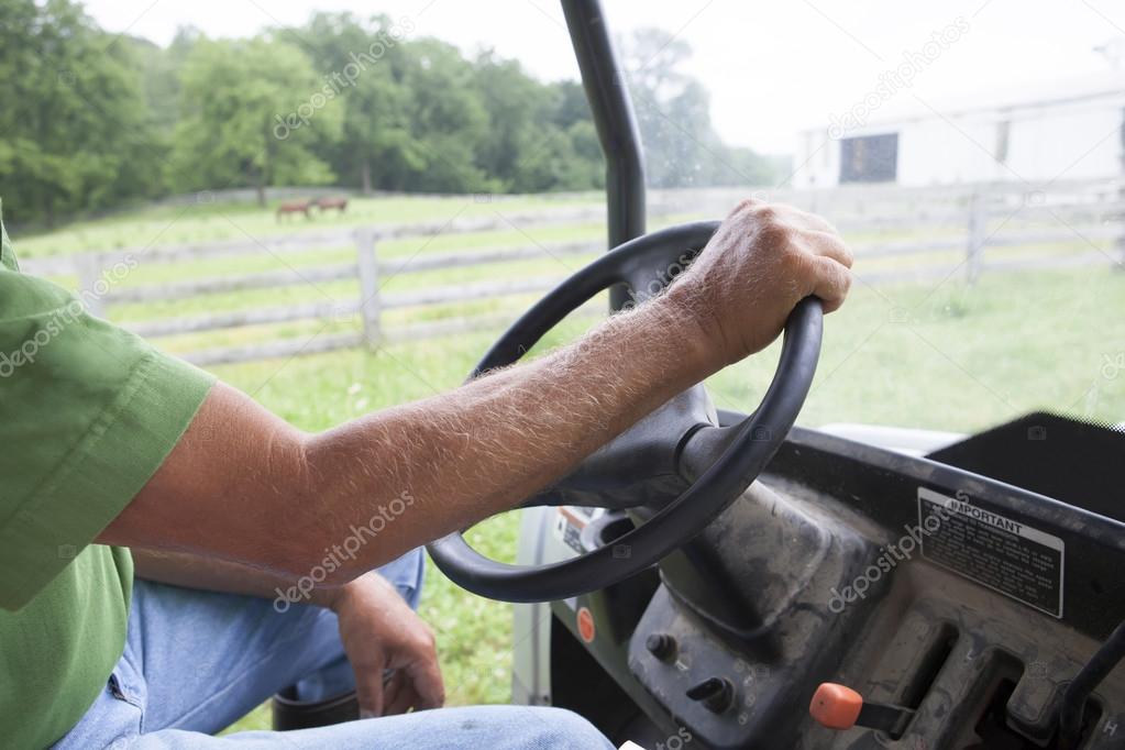 Farmer Driving Tractor