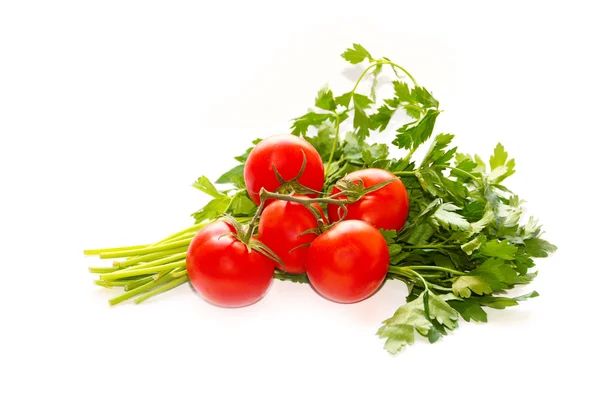 Tomates maduros y un manojo de perejil — Foto de Stock