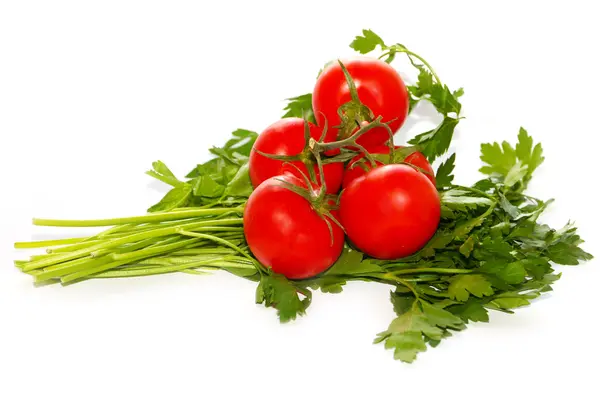 Tomates maduros y un manojo de perejil — Foto de Stock