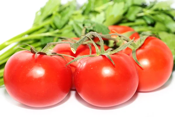 Tomates maduros y un manojo de perejil — Foto de Stock