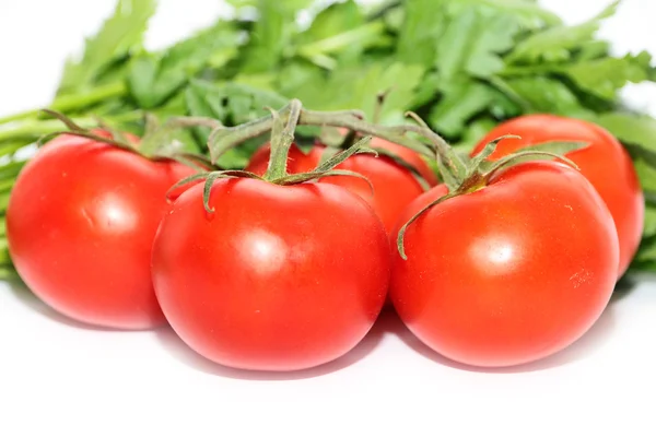 Tomates maduros y un manojo de perejil — Foto de Stock