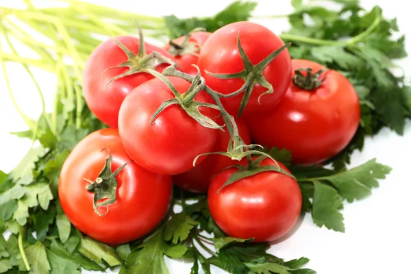 Tomates maduros y un manojo de perejil — Foto de Stock