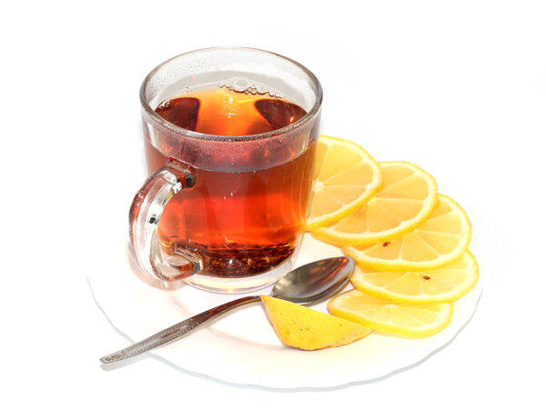glass cup with black tea and fresh lemon slices