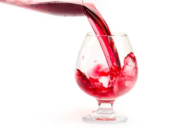 Ένα Ρεύμα Κόκκινου Κρασιού Δημιουργεί Μοτίβα Όταν Χύνεται Ένα Ποτήρι — Φωτογραφία Αρχείου