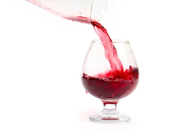 Ένα Ρεύμα Κόκκινου Κρασιού Δημιουργεί Μοτίβα Όταν Χύνεται Ένα Ποτήρι — Φωτογραφία Αρχείου