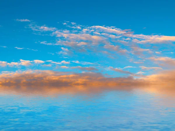 reflection of the blue cloudy sky in the calm surface of the sea space